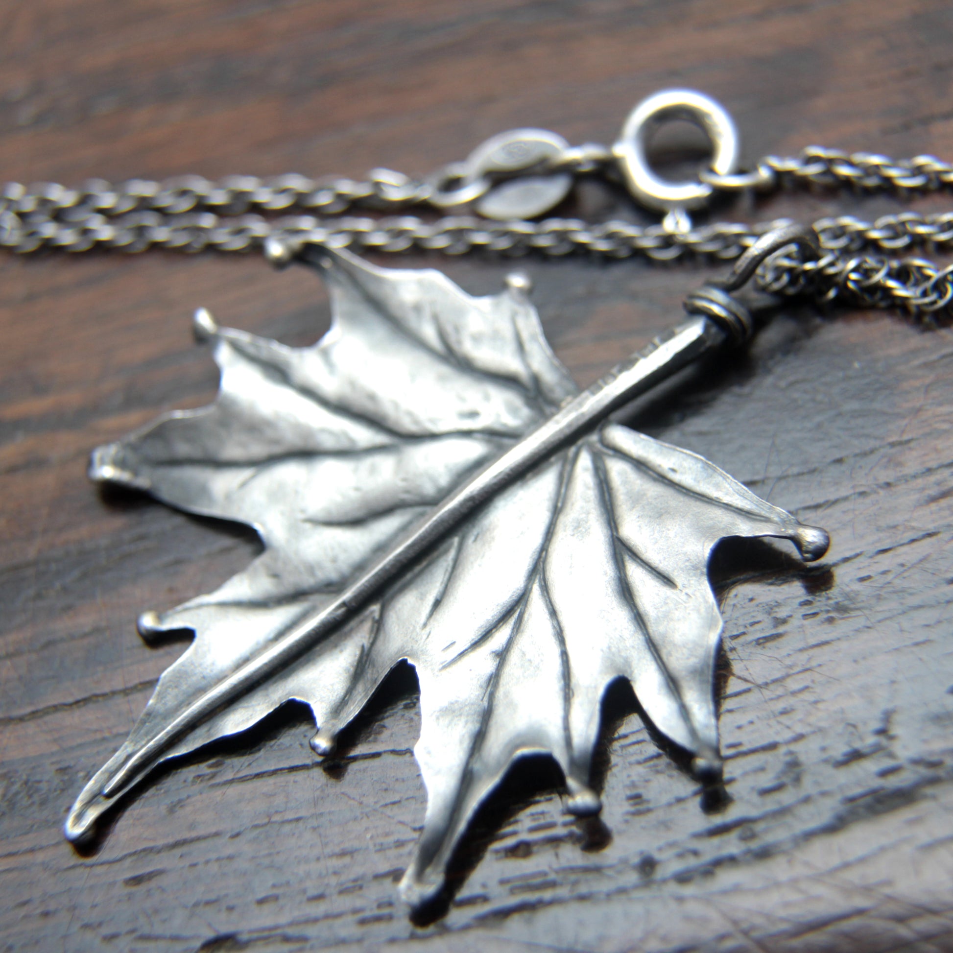 Closeup photo of the back of the Sterling silver Maple pendant designed and made by M Barran at Taitaya Forge