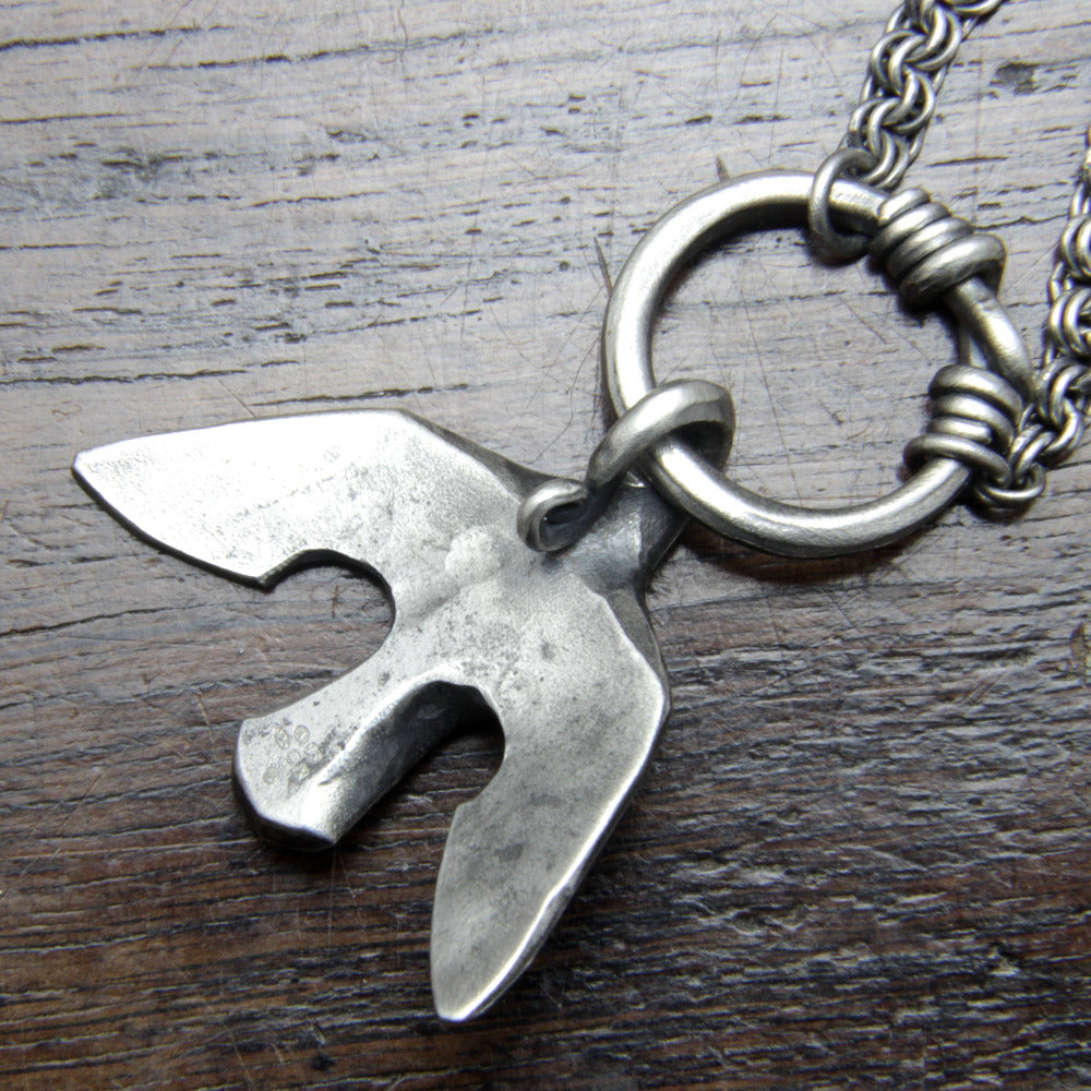 The reverse side of a forged Silver Raven Necklace Taitaya Forge