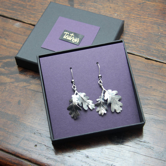 Silver Oak leaf pendant in a card gift box with gilded Taitaya Forge branding.