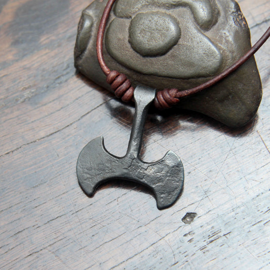 Picture of the front of the Taitaya Forge iron Labrys pendant.