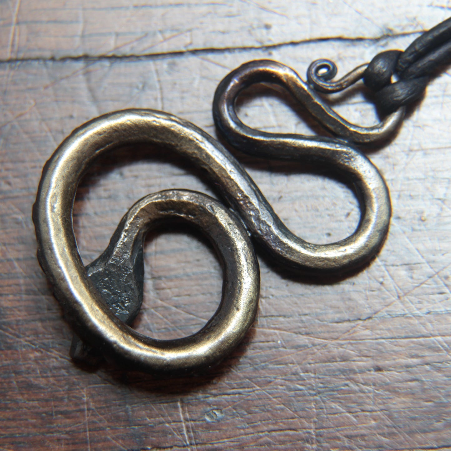 Iron snake pendant, photo of the back