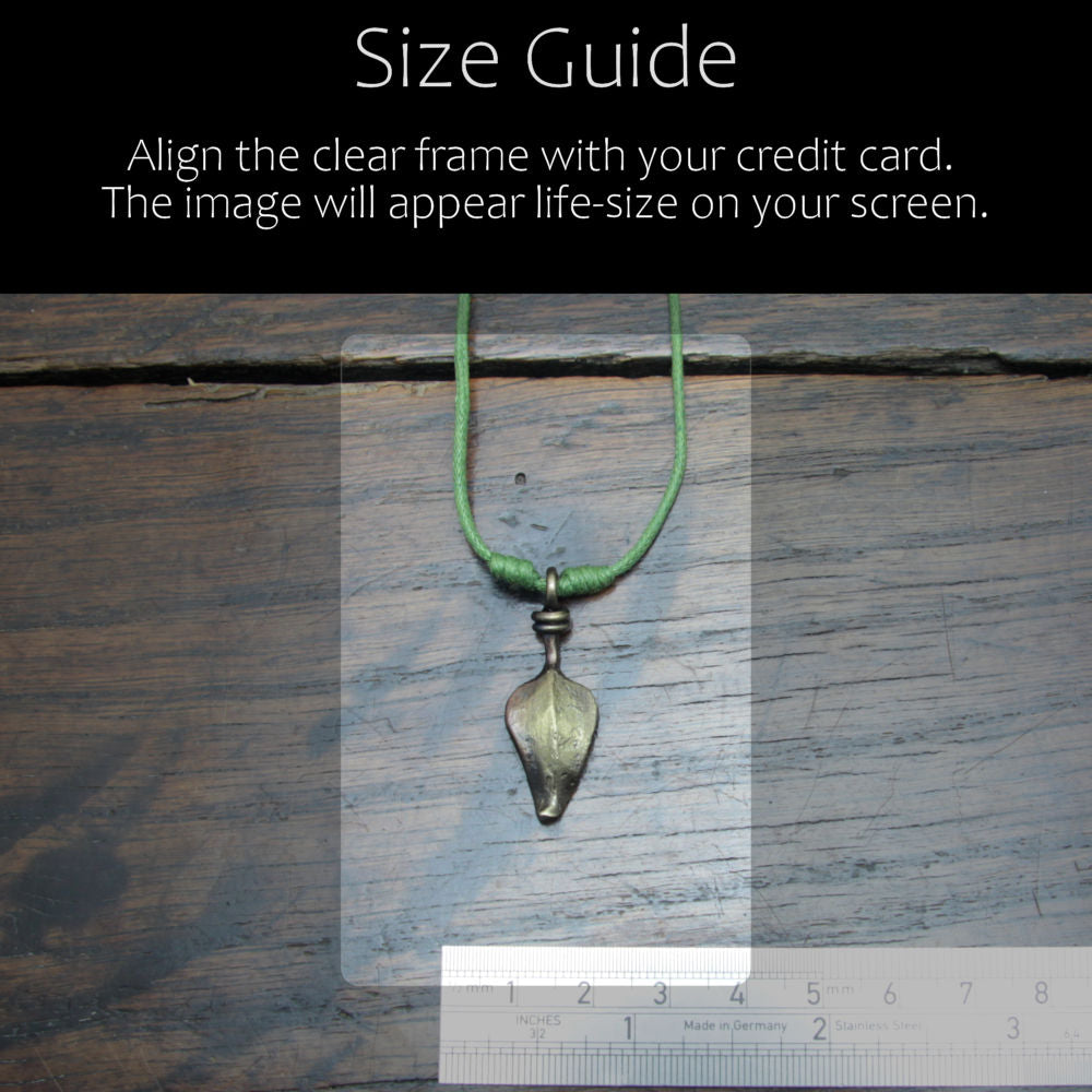 Size reference guid of the forged iron leaf pendant with antique bronze finish in comparison with acredit card and ruler