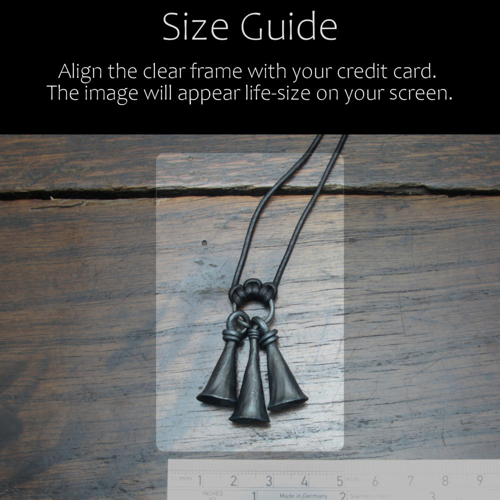 Handforged iron shaman bell pendant made by taitaya forge, size guid in comparison with a credit card and ruler