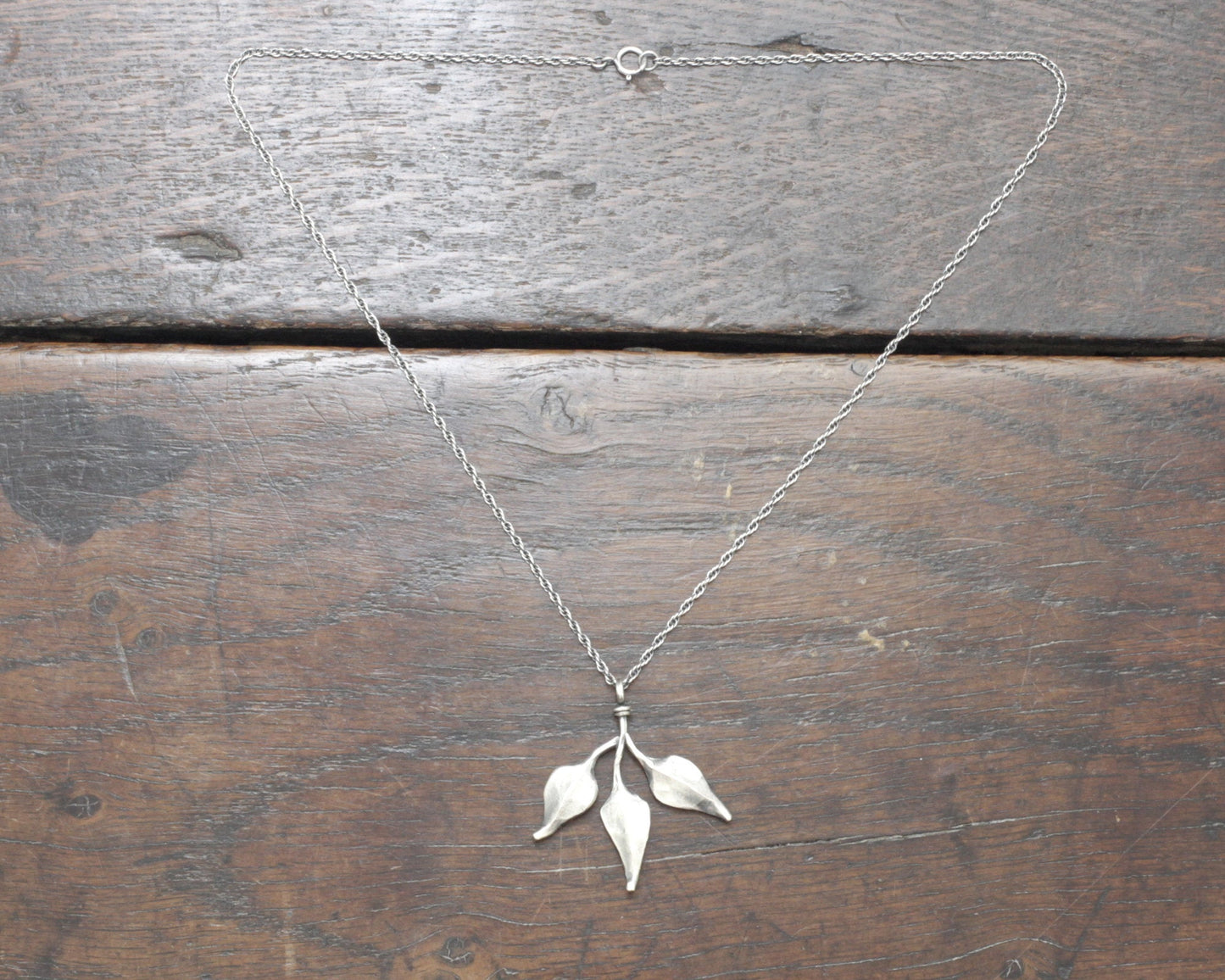 Triple leaf silver pendant. Unique hand forged solid silver necklace on a rope chain.