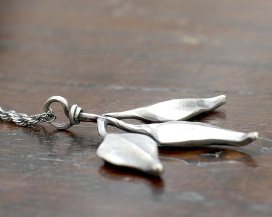 Triple leaf silver pendant. Unique hand forged solid silver necklace on a rope chain.