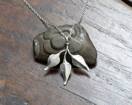 Triple leaf silver pendant. Unique hand forged solid silver necklace on a rope chain.