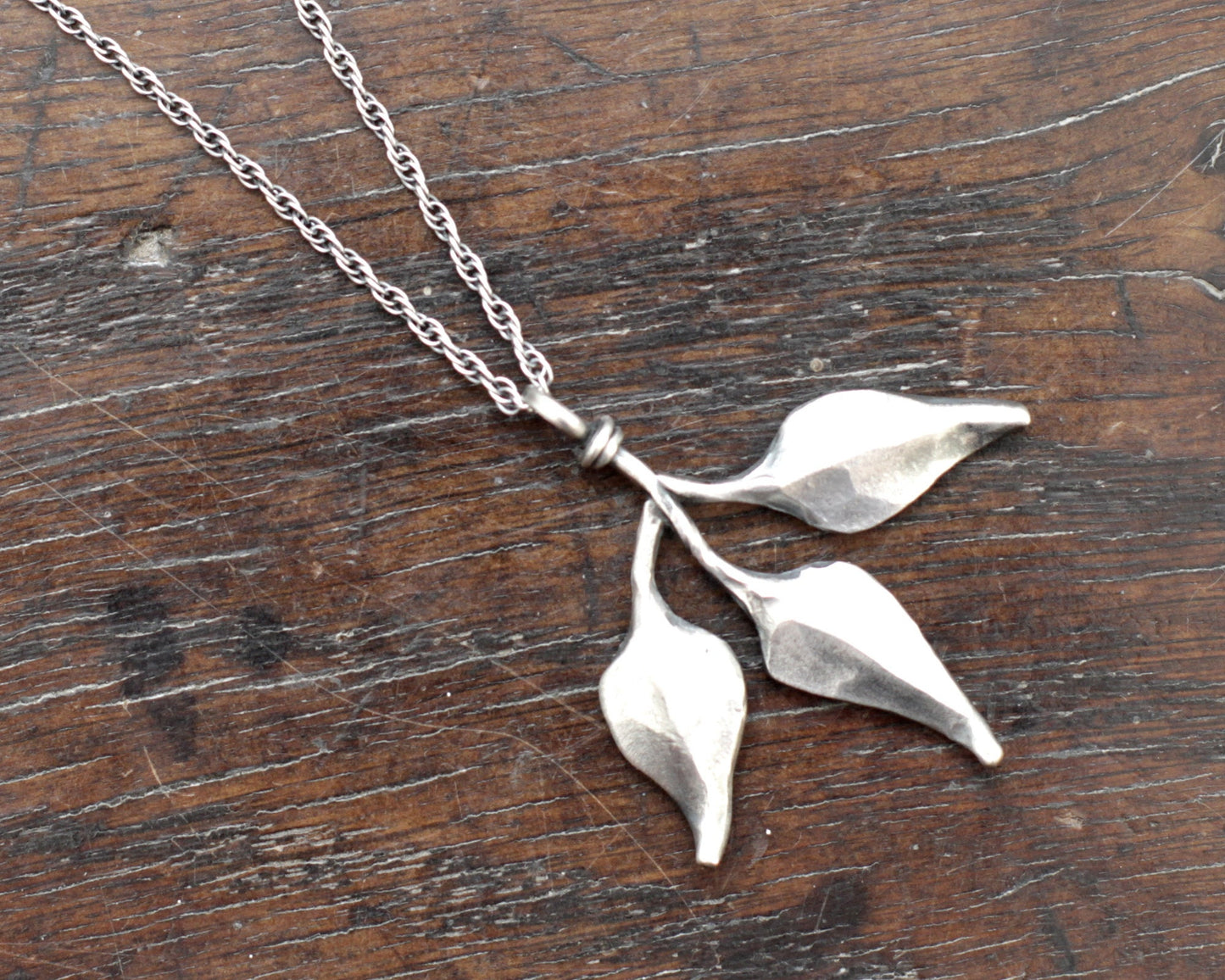 Triple leaf silver pendant. Unique hand forged solid silver necklace on a rope chain.