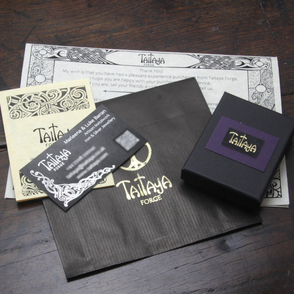 Example of the fully recyclable pape & card packaging, business card and care instructions included in your order from Taitaya Forge