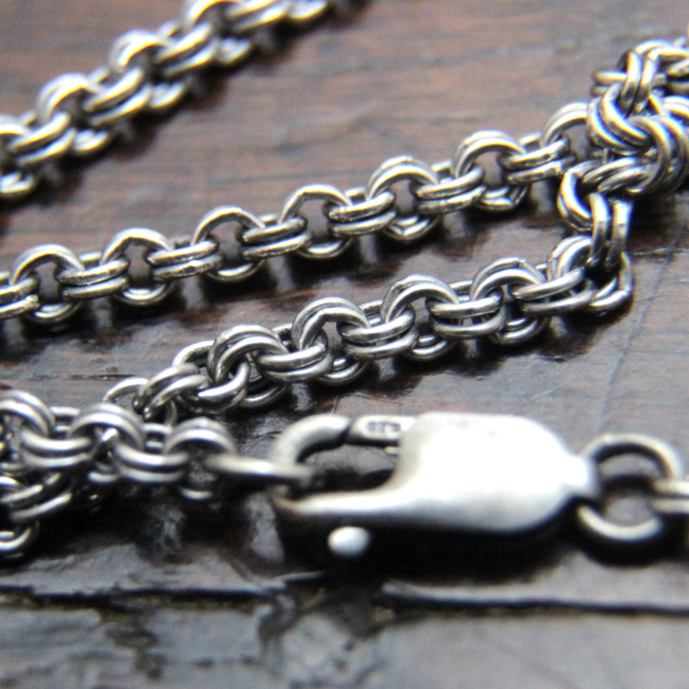 Add a silver chain to your pendant.