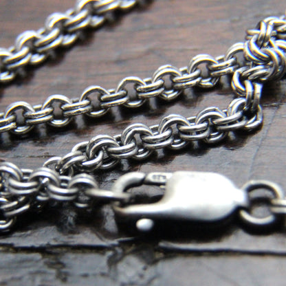 Add a silver chain to your pendant.