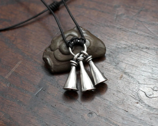 Hot Forged Sterling silver bell necklace by artist blacksmith Marleena Barran from Taitaya Forge