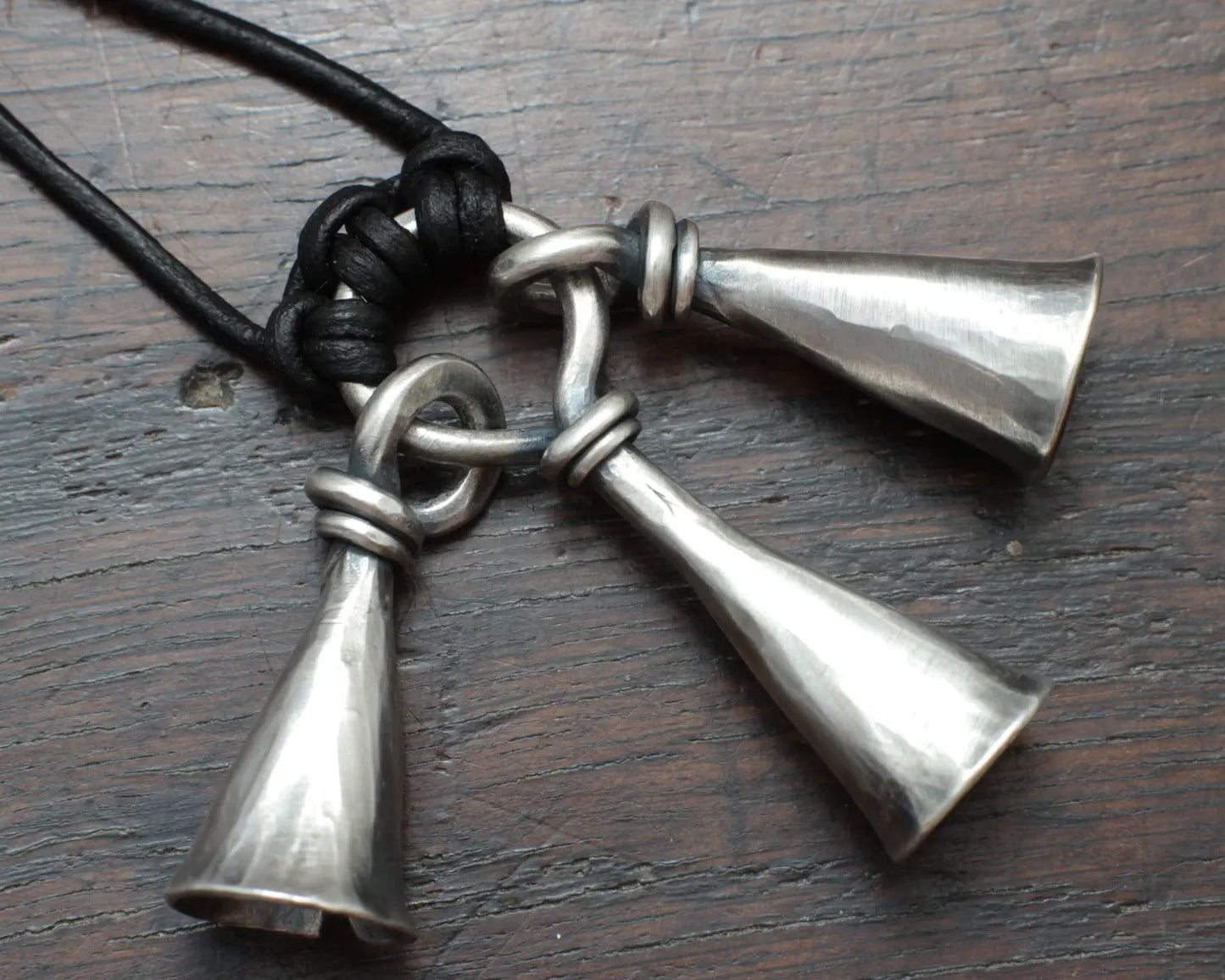 Hot Forged Sterling silver bell necklace by artist blacksmith Marleena Barran from Taitaya Forge