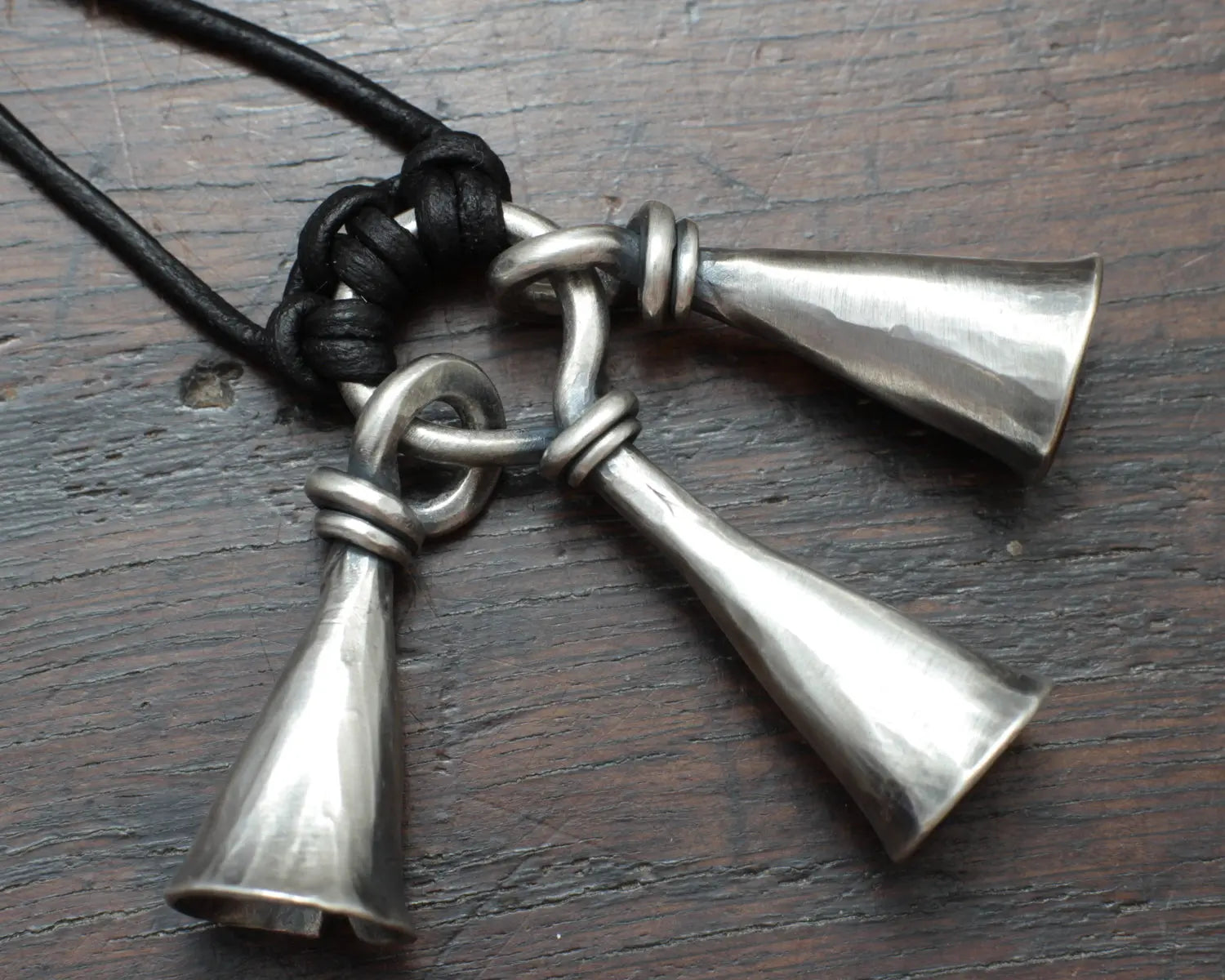 Hot Forged Sterling silver bell necklace by artist blacksmith Marleena Barran from Taitaya Forge