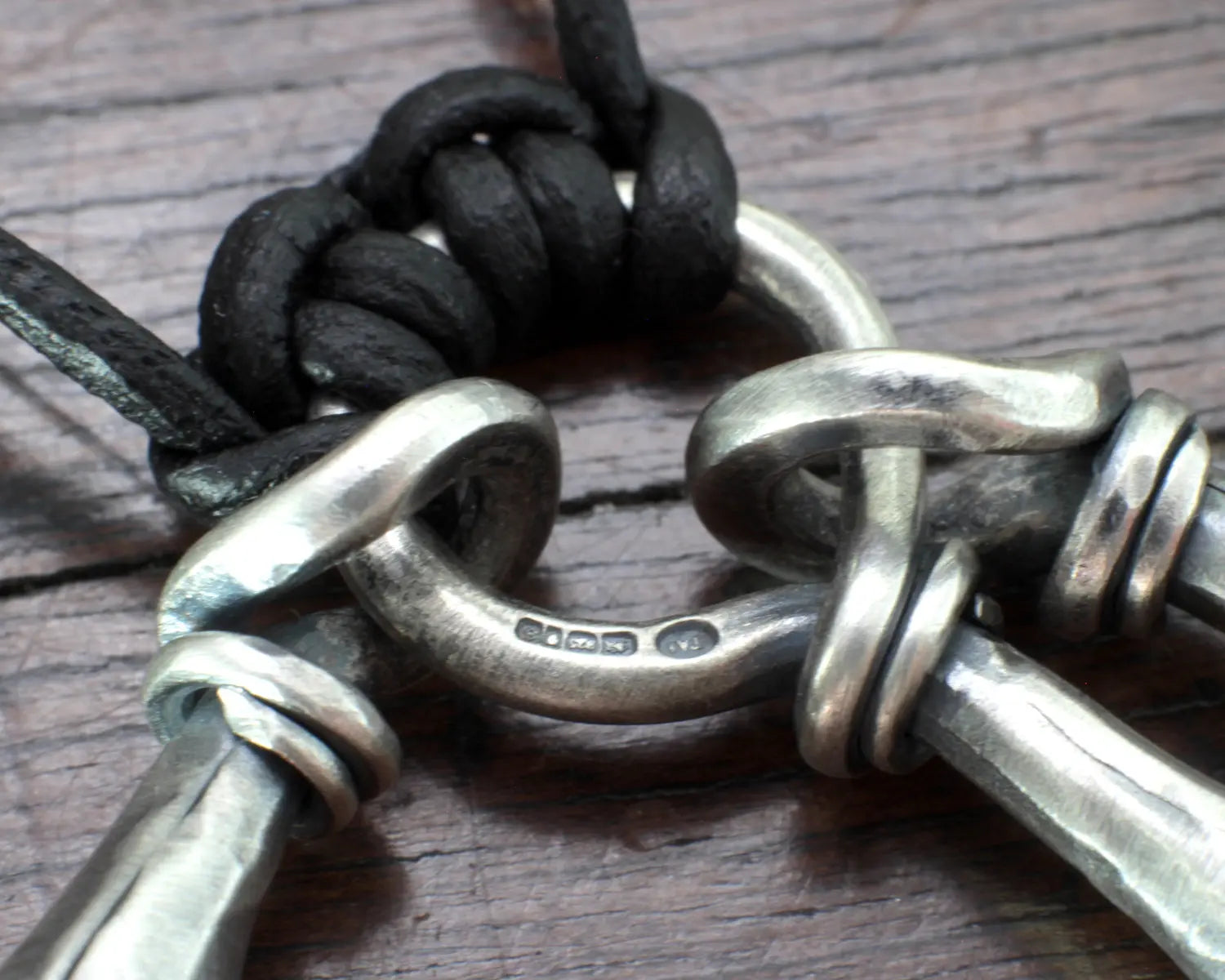 Hot Forged Sterling silver bell necklace by artist blacksmith Marleena Barran from Taitaya Forge
