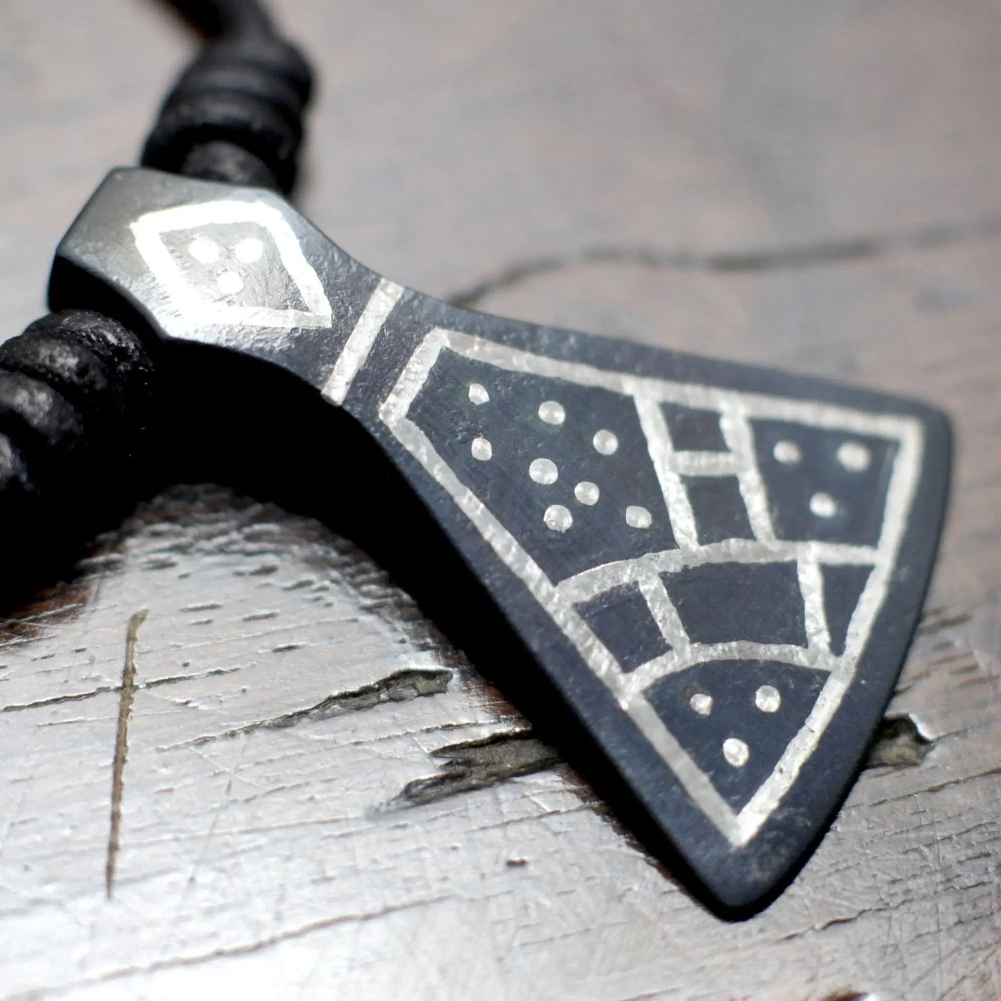 Hand forged Viking axe pendant inspired after the historical Mammen axe, decorated with silver inlay using the same technique