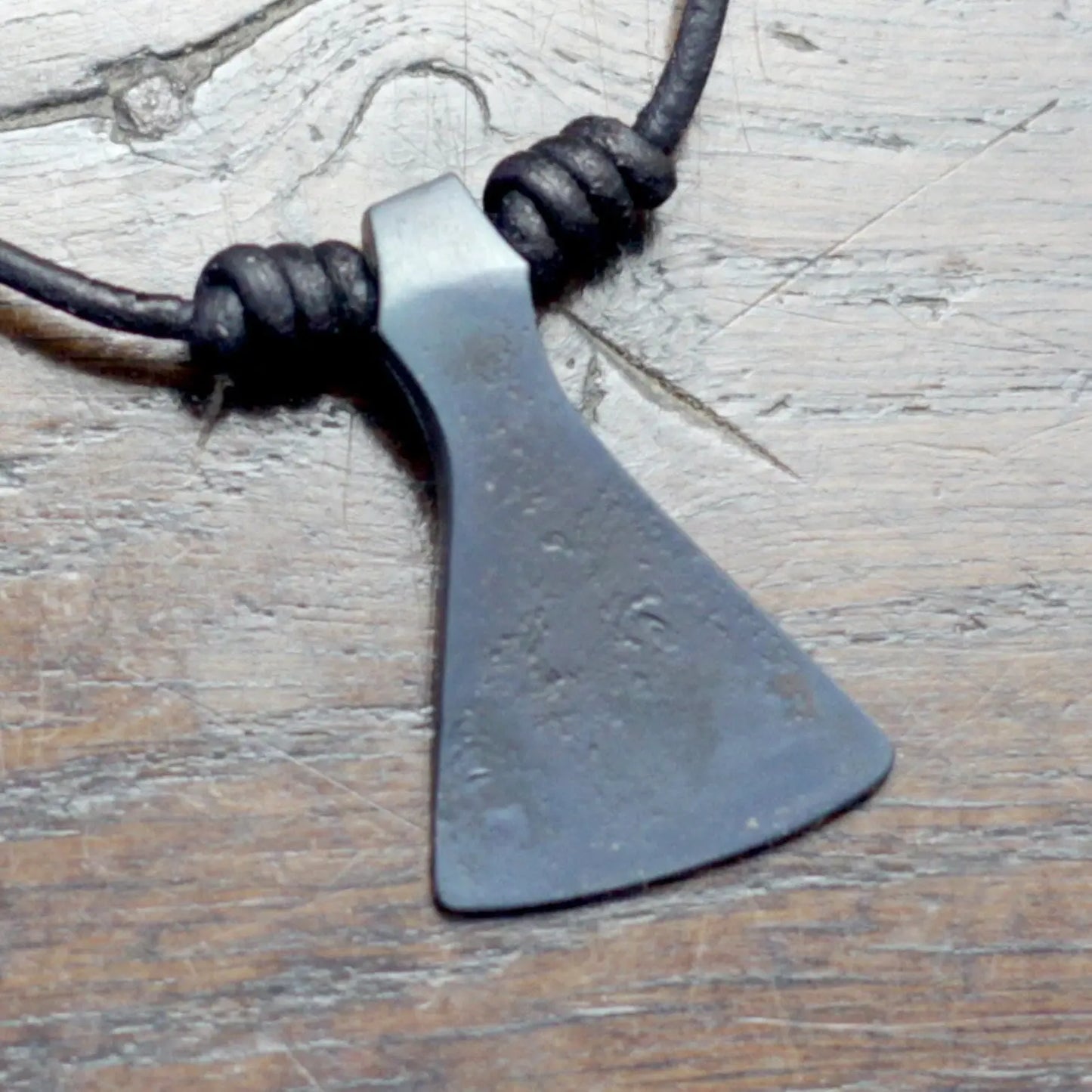 Hand forged Viking axe pendant inspired after the historical Mammen axe, decorated with silver inlay using the same technique