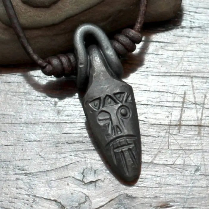 Viking style mask pendant of one eyed Odin made from black iron
