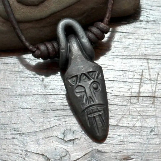 Viking style mask pendant of one eyed Odin made from black iron