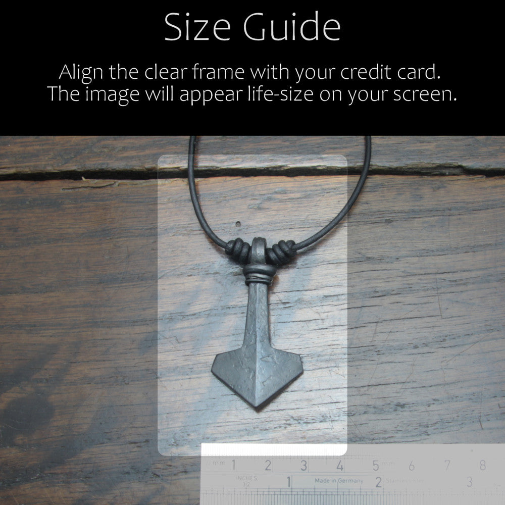 Hand forged large ridged iron Mjolnir Thor's hammer pendant made by taitaya forge, size guide in comparison with a credit card and ruler