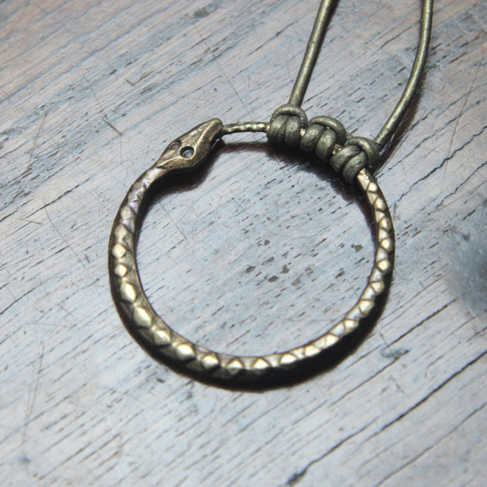 Ouroboros Snake Pendant, an infinity symbol hand forged out of pure iron