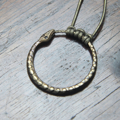 Ouroboros Snake Pendant, an infinity symbol hand forged out of pure iron