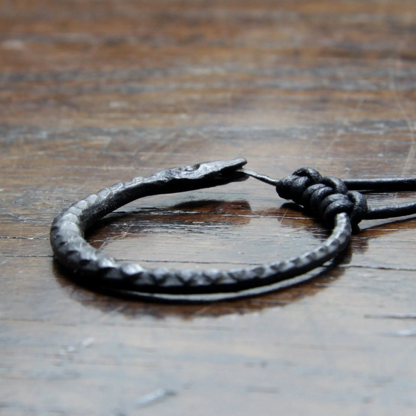 Ouroboros Snake Pendant, an infinity symbol hand forged out of pure iron