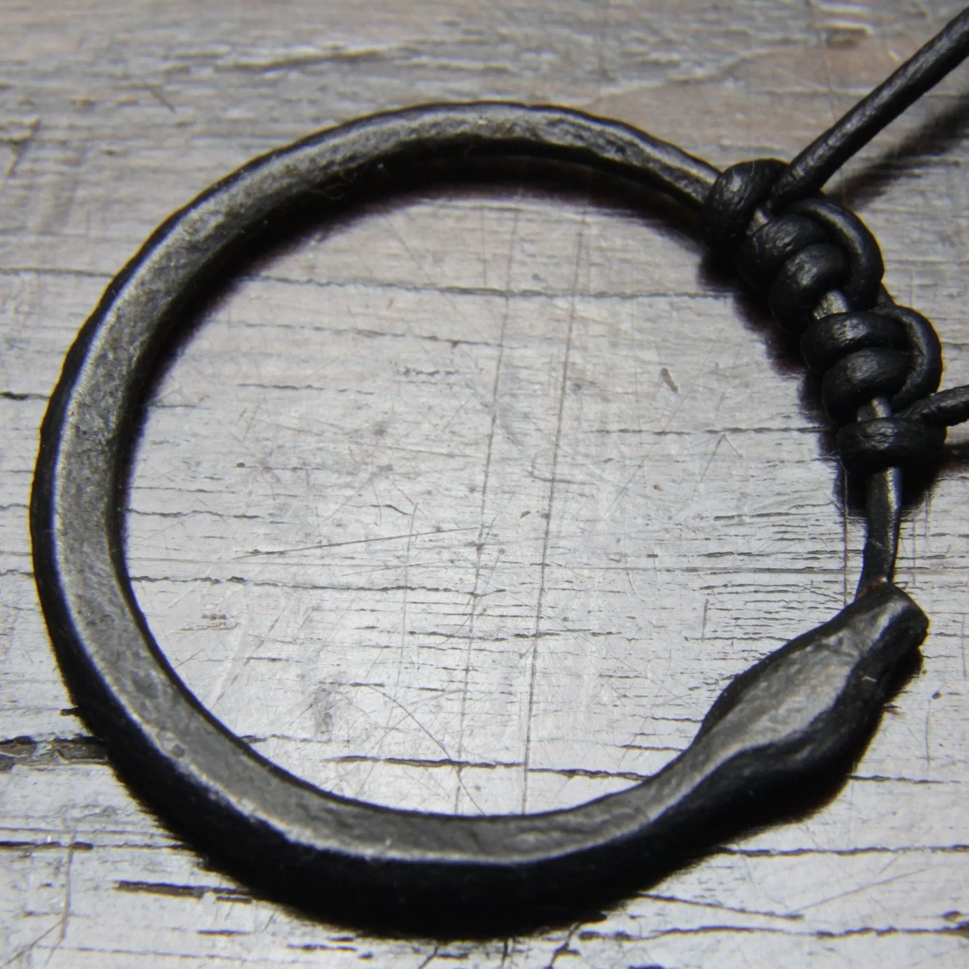 Ouroboros Snake Pendant, an infinity symbol hand forged out of pure iron