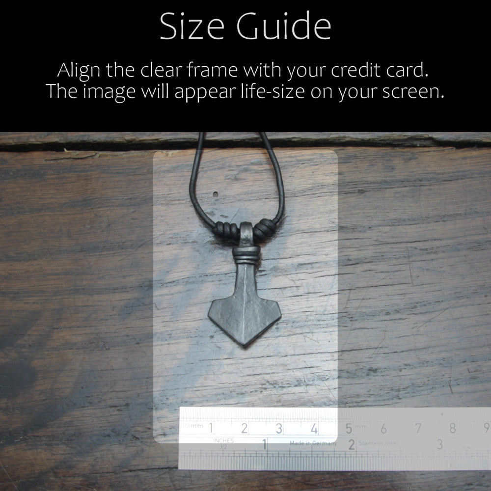 Handforged small ridged iron Mjolnir Thor's hammer pendant made by taitaya forge, size guide in comparison with a credit card and ruler