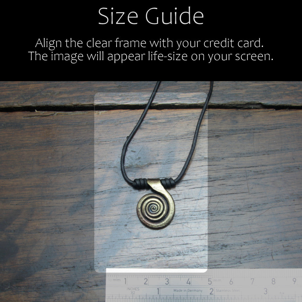 Size reference guid of the forged iron spiral pendant with antique bronze finish in comparison with acredit card and ruler