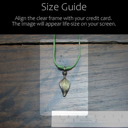 Size reference guid of the forged iron leaf pendant with antique bronze finish in comparison with acredit card and ruler