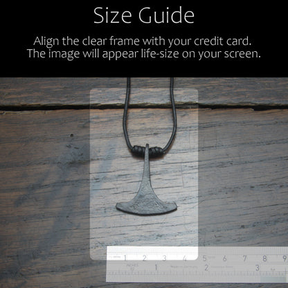 Handforged Finnish iron Ukonvasara pendant made by taitaya forge, size guide in comparison with a credit card and ruler