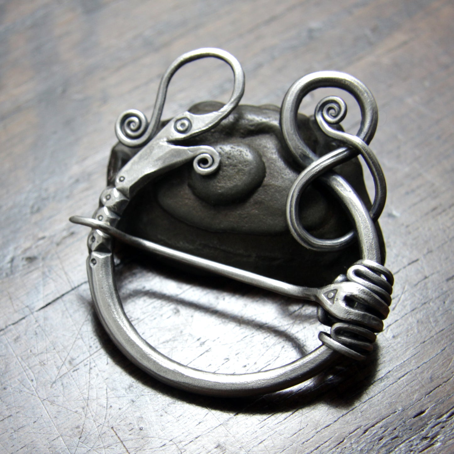 Unique Intricate hand forged silver penannular Dragon brooch made by Taitaya Forge