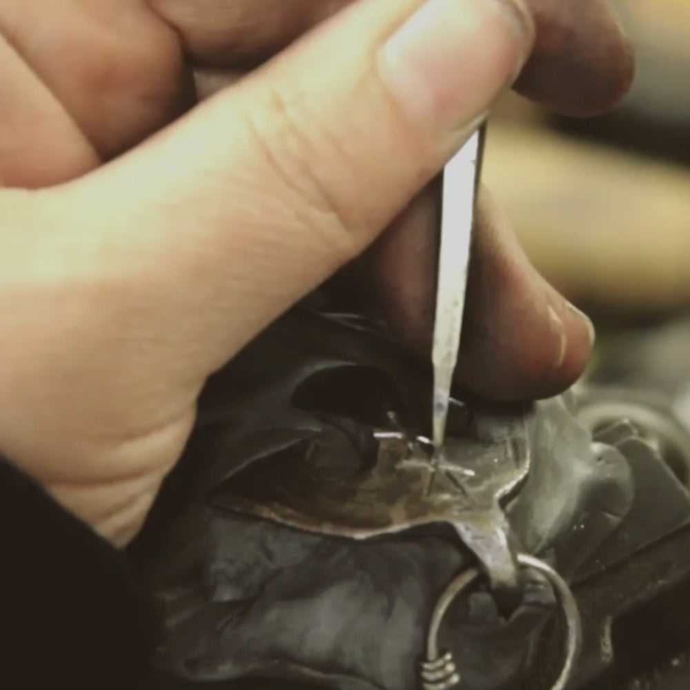 Inlay of a Custom Silver Inlaid Iron Raven Pendant