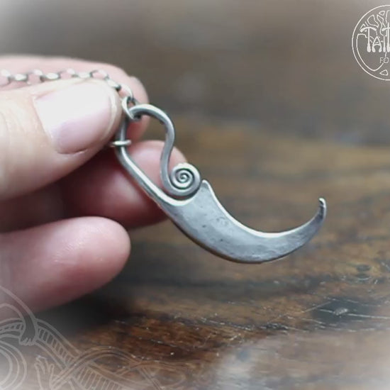 Forged silver sickle pendant by M.Barran, Taitaya Forge, UK