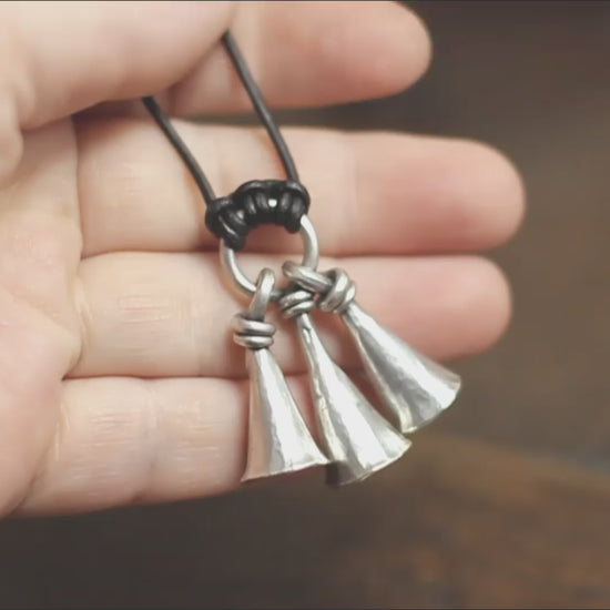 Hot Forged Sterling silver bell necklace by artist blacksmith Marleena Barran from Taitaya Forge