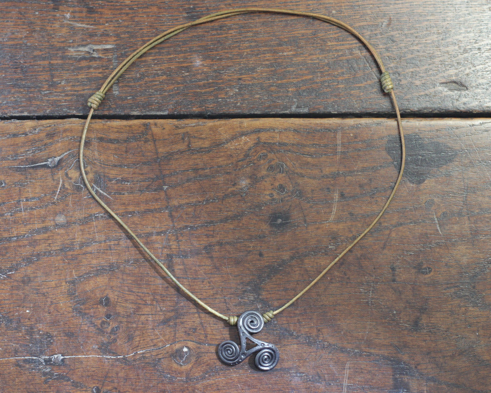 Hand Forged Iron Triskelion Necklace, designed and made by Blacksmith Marleena Barran from Taitaya Forge. View from the top. 