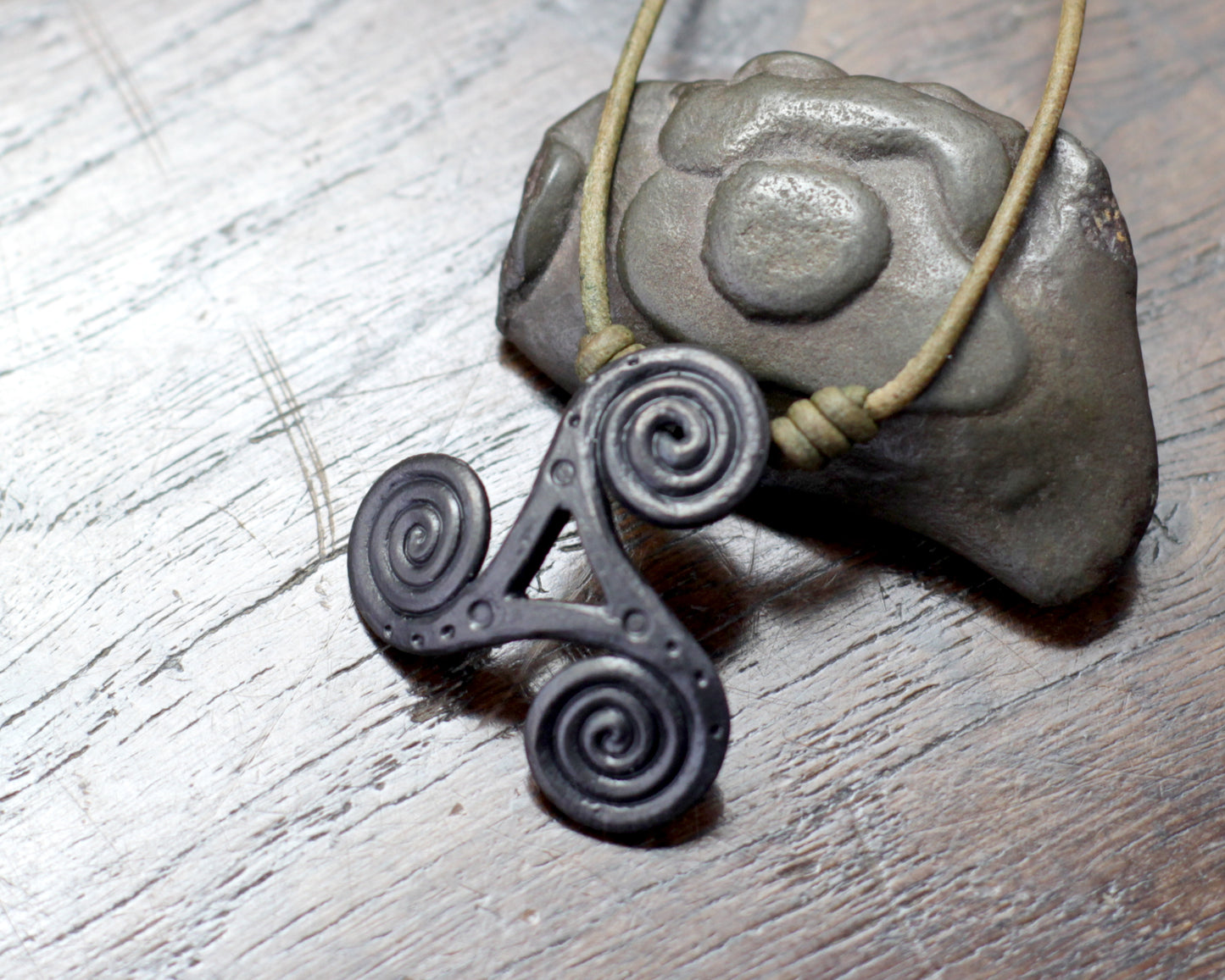 Hand Forged Iron Triskelion Necklace, designed and made by Blacksmith Marleena Barran from Taitaya Forge