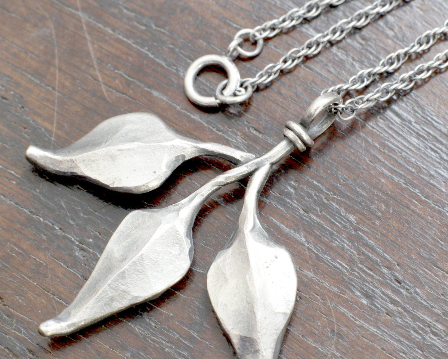 Triple leaf silver pendant. Unique hand forged solid silver necklace on a rope chain.